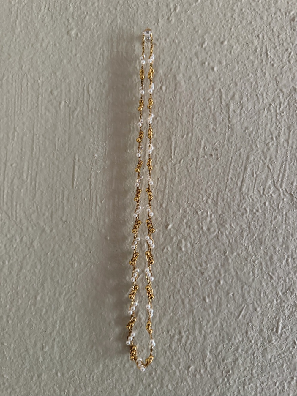 White and gold bead gold-tone metal wrap necklace